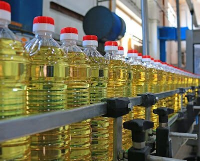 Sunflower oil in the bottle moving on production line