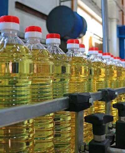 Sunflower oil in the bottle moving on production line Sunflower oil in the bottle moving on production line
