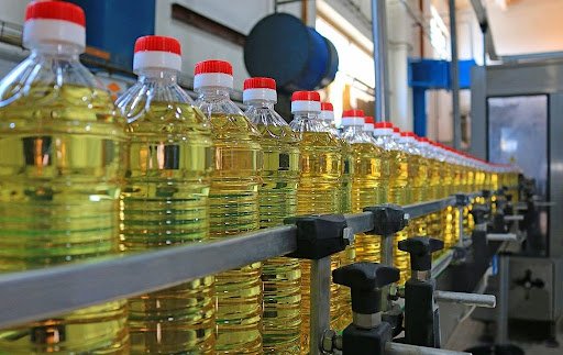 Sunflower oil in the bottle moving on production line